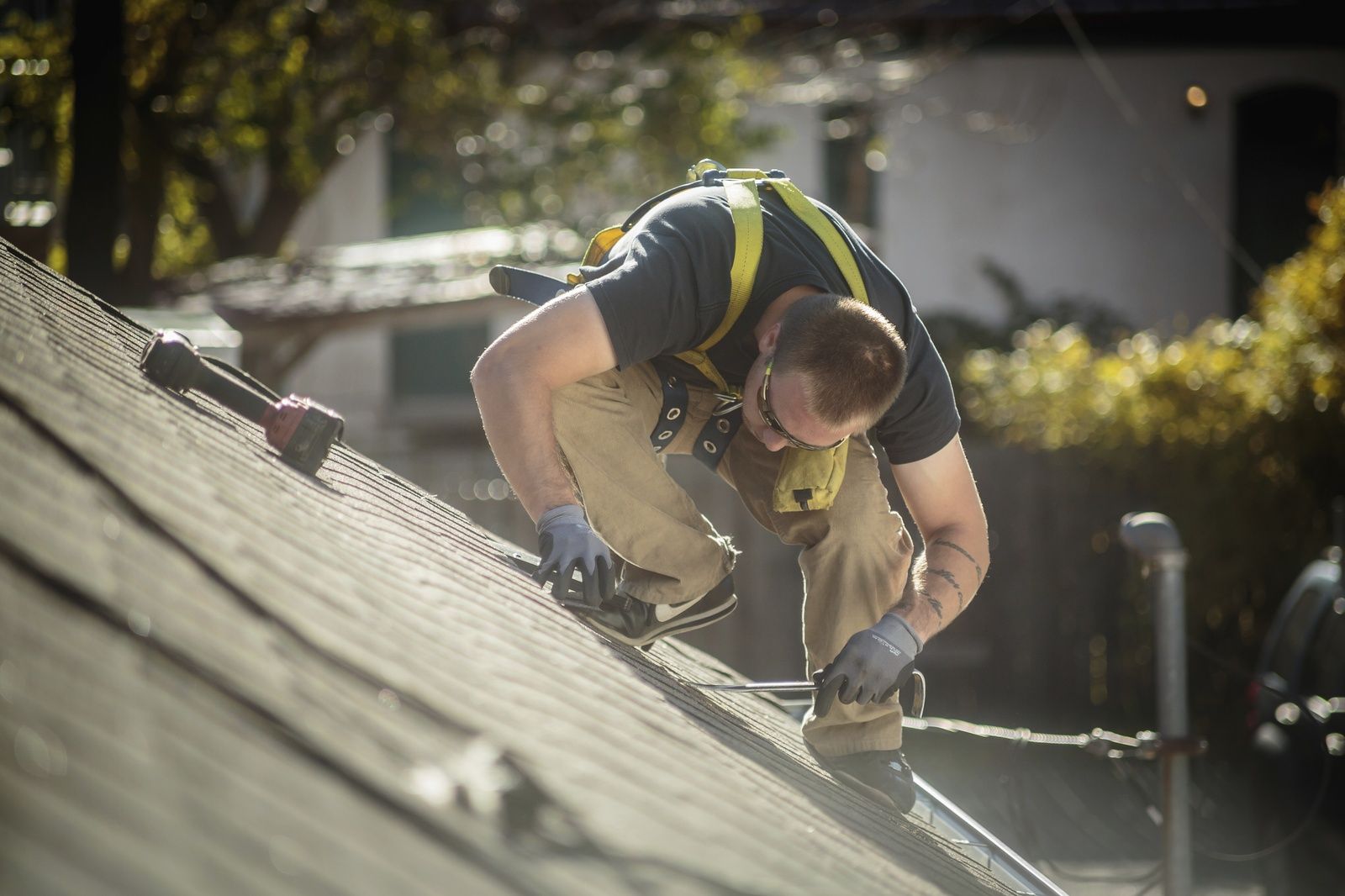 Roofer Installing Solar Panels On House Resized