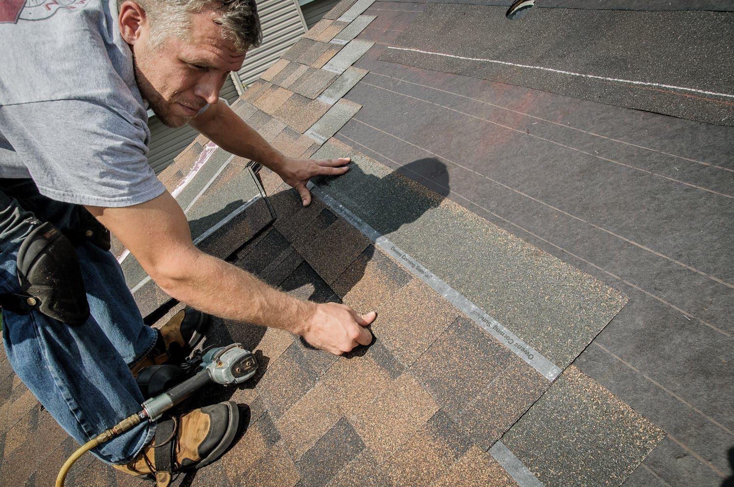 Craftsmen Home Improvements Roofing Contractor Replacing Shingles On Roof